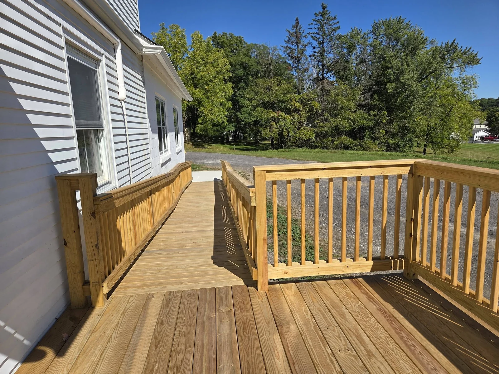 View along a wood ramp with railings